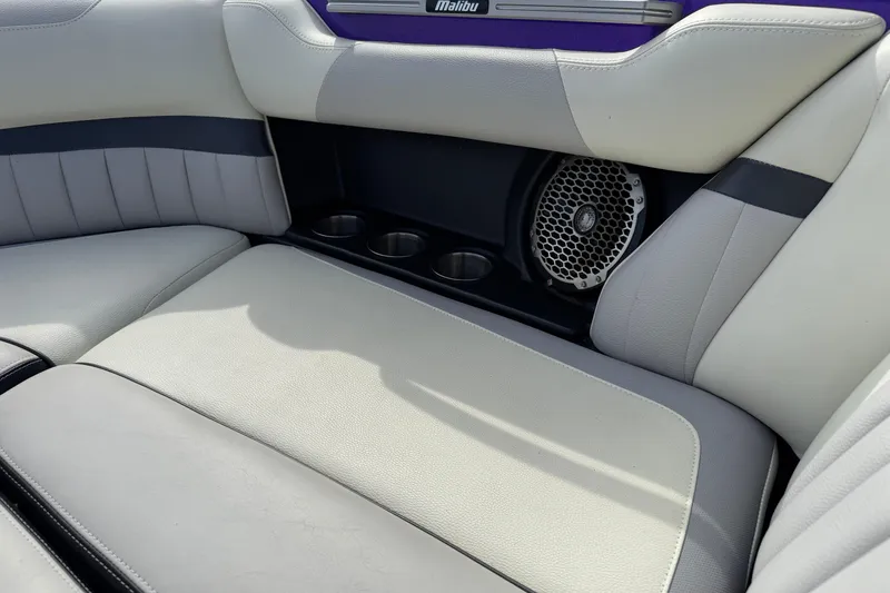 Slide: The Image of 2015 Malibu Wakesetter 24 MXZ interior with speaker and cup holders. - 17