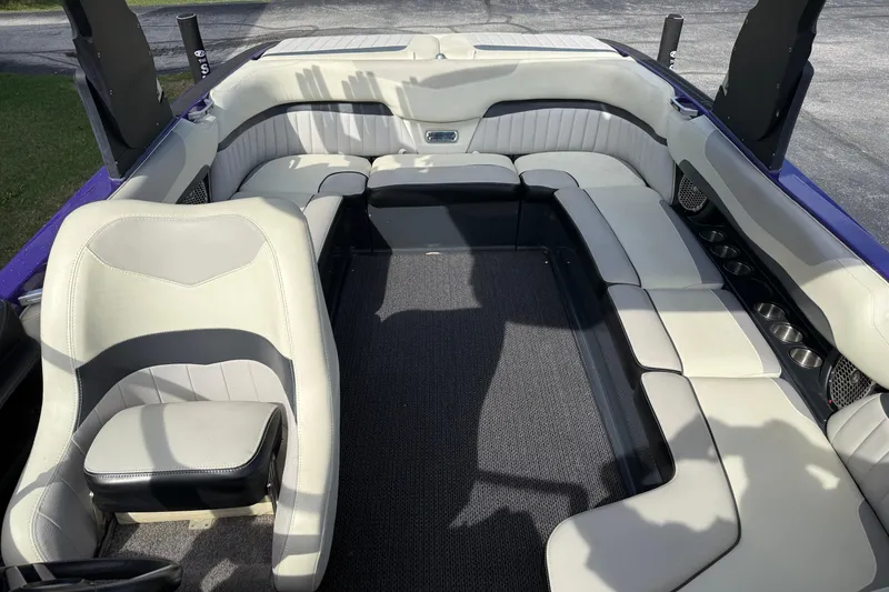 Slide: The Image of Interior of 2015 Malibu Wakesetter 24 MXZ boat with spacious seating and cup holders. - 18