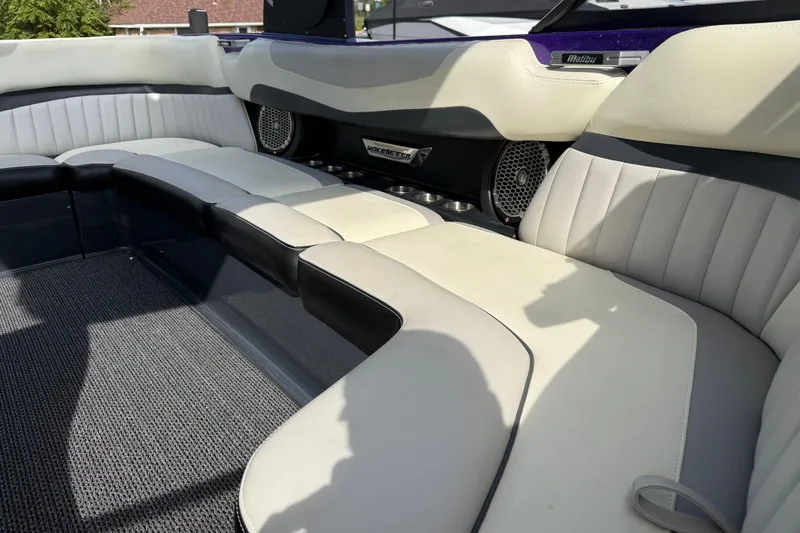 Slide: The Image of Interior of 2015 Malibu Wakesetter 24 MXZ boat with plush seating and speakers. - 19