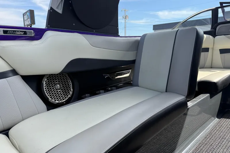 Slide: The Image of 2015 Malibu Wakesetter 24 MXZ interior with premium seating and audio system. - 24