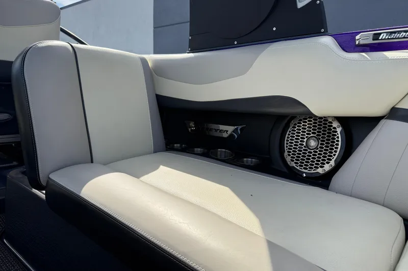 Slide: The Image of 2015 Malibu Wakesetter 24 MXZ interior with speaker and cup holders. - 25