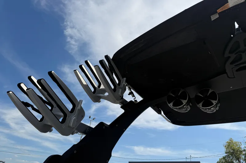 Slide: The Image of 2015 Malibu Wakesetter 24 MXZ wakeboard racks and speakers against blue sky. - 27