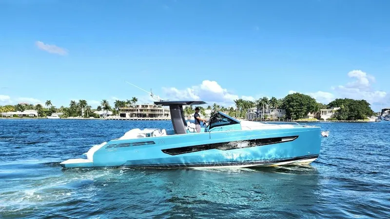 Slide: The Image of 2024 Fiart 39 Seawalker yacht cruising on a sunny day, with scenic waterfront background. - 4