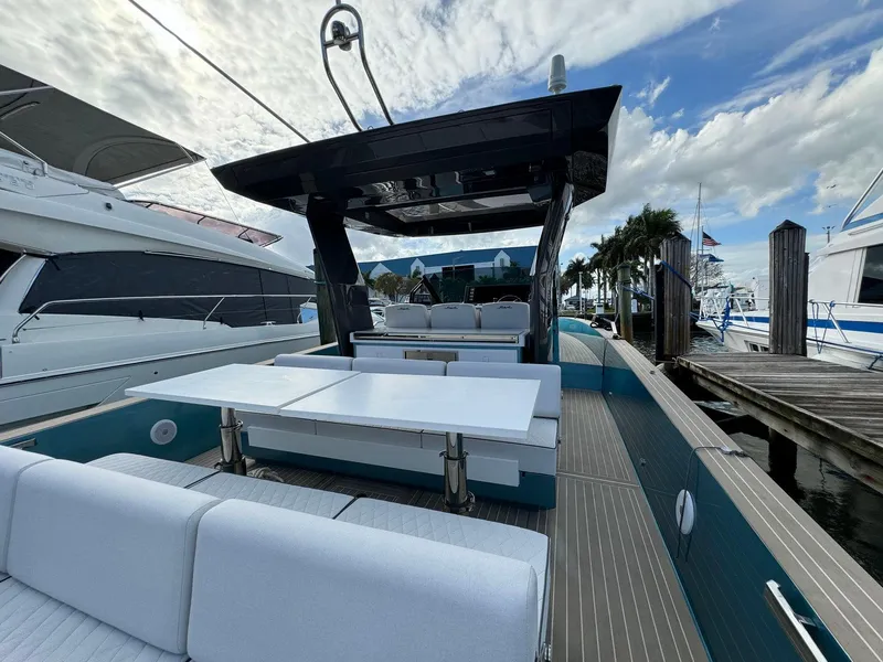 Slide: The Image of 2024 Fiart 39 Seawalker yacht with sleek deck design, docked at marina. - 6