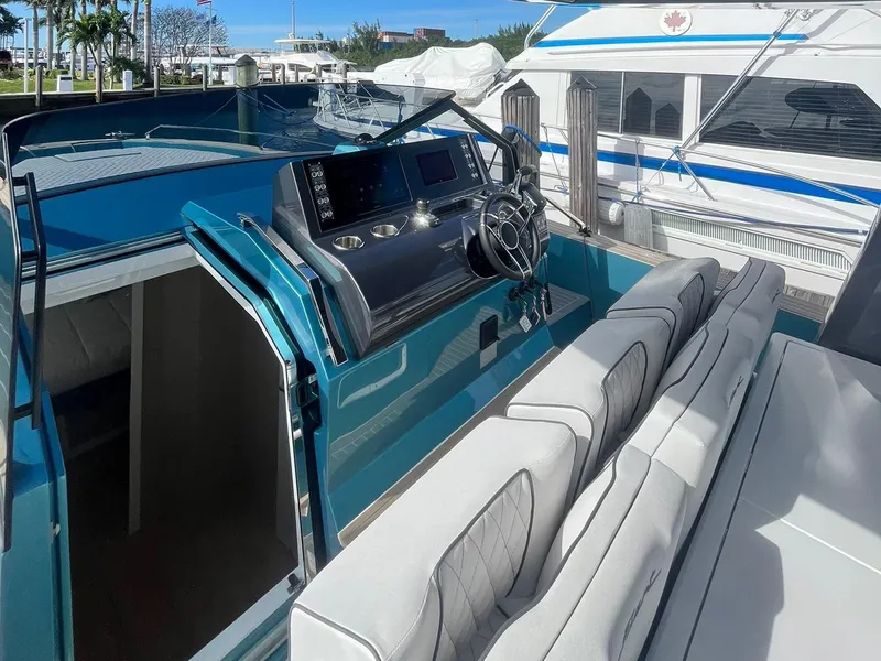 Slide: The Image of 2024 Fiart 39 Seawalker yacht interior with modern helm and seating. - 8