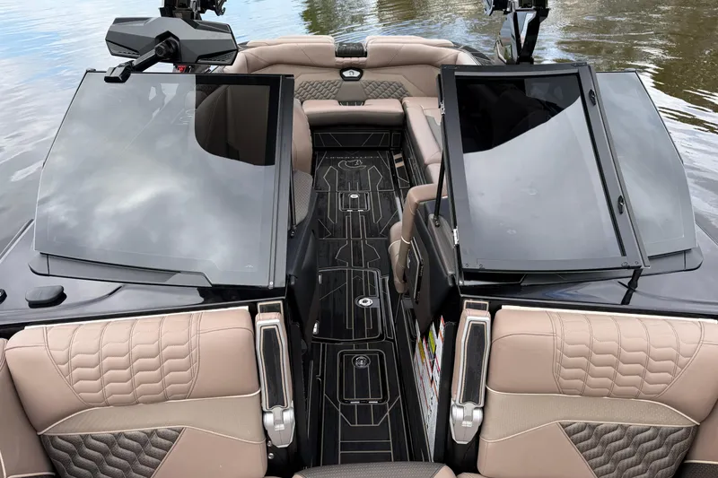 Slide: The Image of 2026 Centurion Ri245 boat interior with luxurious seating and sleek design on the water. - 15