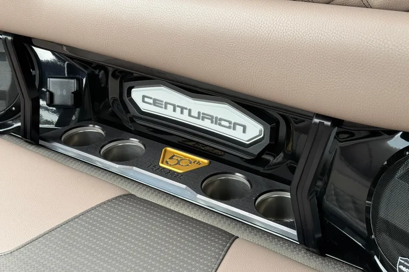 Slide: The Image of Interior of 2026 Centurion Ri245 boat with cup holders and 50th anniversary emblem. - 17