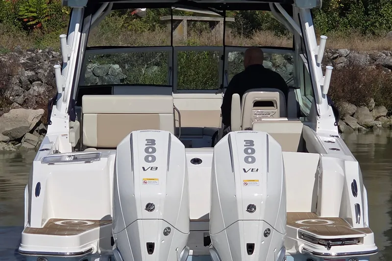 Slide: The Image of 2024 Boston Whaler 280 Vantage with dual 300 V8 engines, rear view on water. - 10