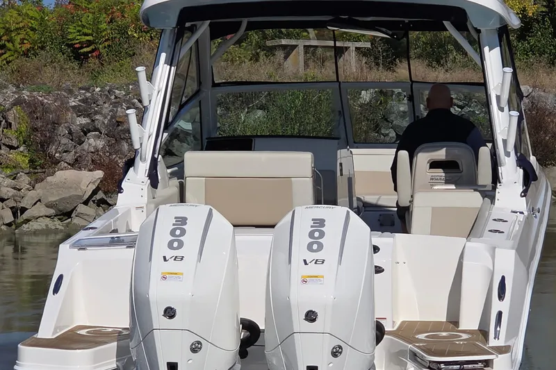 Slide: The Image of 2024 Boston Whaler 280 Vantage with dual 300 V8 engines, rear view on water. - 6