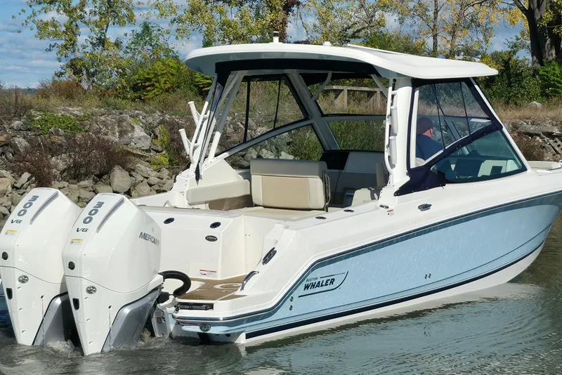 Slide: The Image of 2024 Boston Whaler 280 Vantage boat with dual Mercury 300 V8 engines on water. - 9