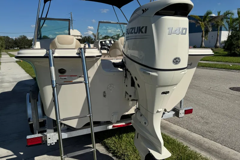 Slide: The Image of 2020 Carolina Skiff 21 LS DC boat with Suzuki 140 outboard motor on trailer. - 15