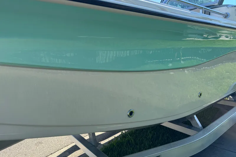 Slide: The Image of 2020 Carolina Skiff 21 LS DC boat hull on trailer, close-up view. - 21