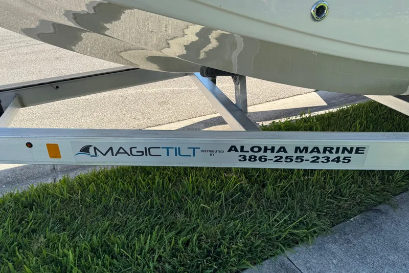 Slide: The Image of Trailer for 2020 Carolina Skiff 21 LS DC by Magic Tilt, Aloha Marine contact info visible. - 22
