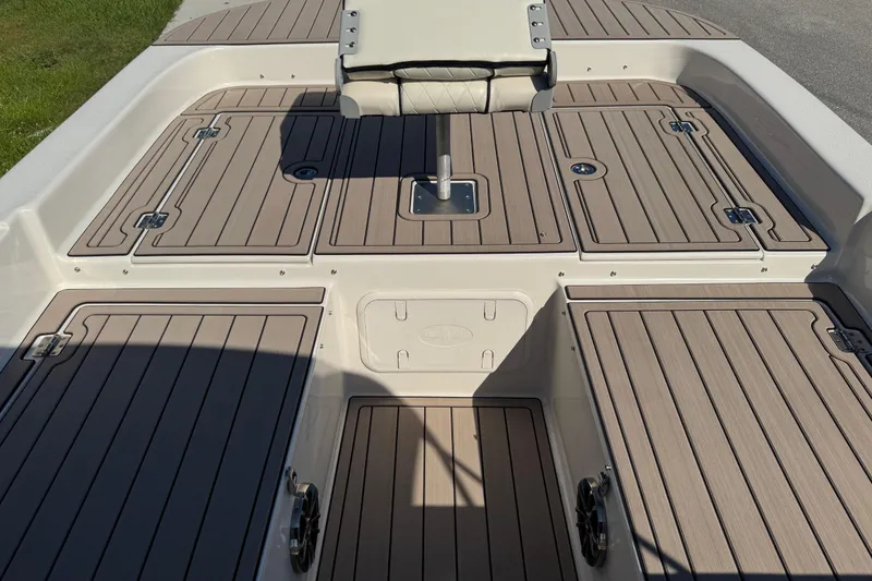 Slide: The Image of 2020 Carolina Skiff 21 LS DC boat deck with storage compartments and seating. - 25