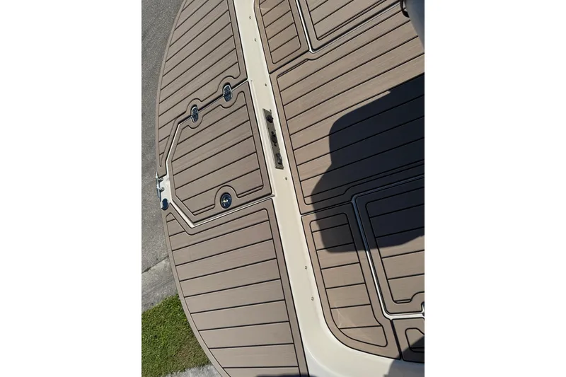 Slide: The Image of 2020 Carolina Skiff 21 LS DC boat deck with brown non-slip surface. - 28