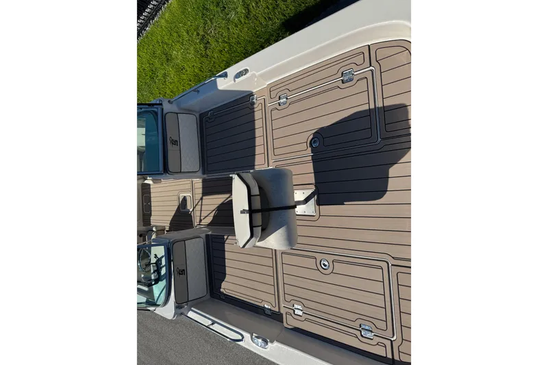 Slide: The Image of 2020 Carolina Skiff 21 LS DC boat deck with seating and storage compartments. - 30