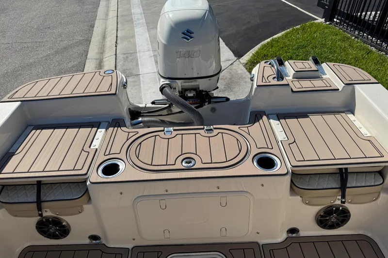 Slide: The Image of 2020 Carolina Skiff 21 LS DC boat with Suzuki 140 engine, featuring deck and storage compartments. - 39