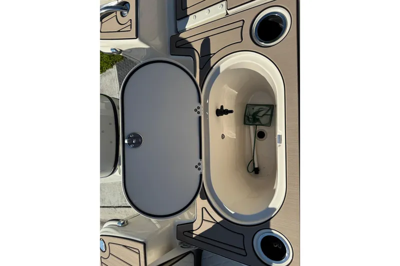 Slide: The Image of 2020 Carolina Skiff 21 LS DC boat interior with open storage compartment. - 44