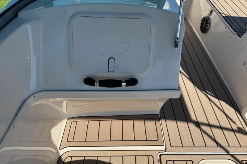 Slide: The Image of 2020 Carolina Skiff 21 LS DC boat interior with sleek deck and storage compartment. - 46