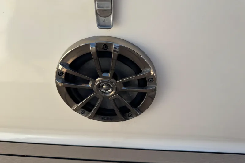 Slide: The Image of Speaker on a 2020 Carolina Skiff 21 LS DC boat, featuring a sleek metal grille. - 53