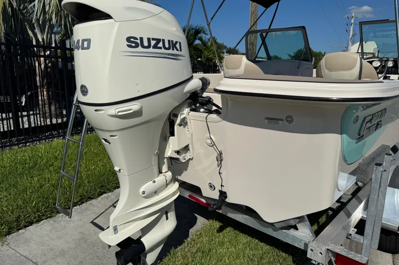 Slide: The Image of 2020 Carolina Skiff 21 LS DC boat with Suzuki 140 outboard motor on trailer. - 6