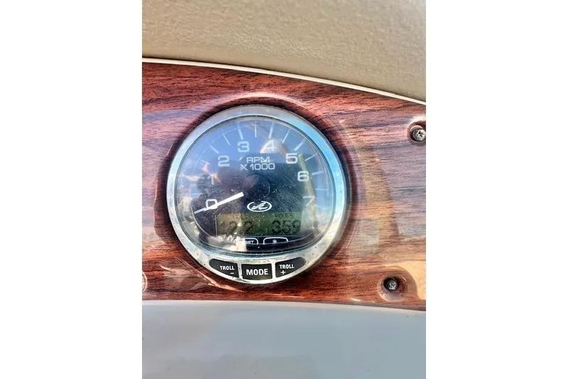 Slide: The Image of Tachometer of 2007 Sea Ray 240 Sundeck boat, displaying RPM and mode settings. - 5
