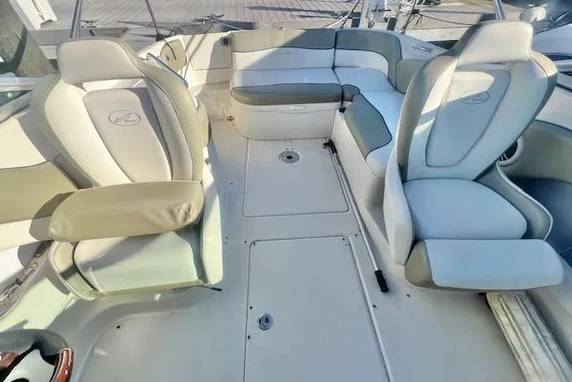 Slide: The Image of 2007 Sea Ray 240 Sundeck boat interior with seating and deck view. - 9