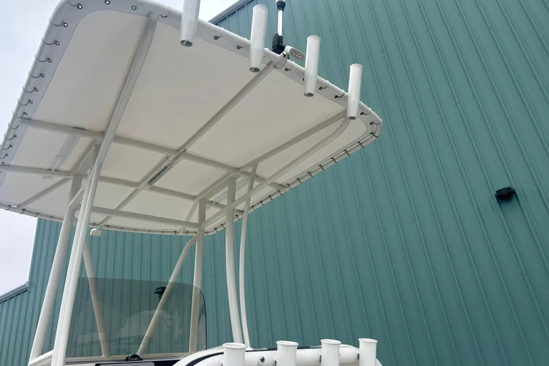 Slide: The Image of 2023 Robalo R180 Center Console boat interior with seating and storage compartment. - 19