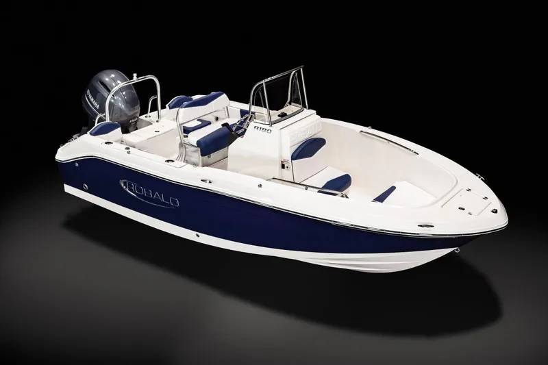 Slide: The Image of 2023 Robalo R180 Center Console boat on trailer in indoor showroom. - 2