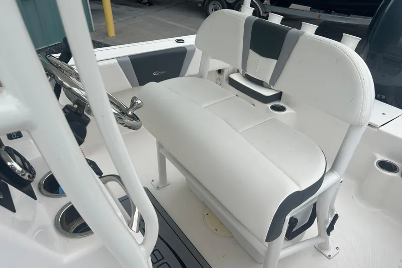 Slide: The Image of 2023 Robalo R180 Center Console boat storage with portable toilet and rope. - 20