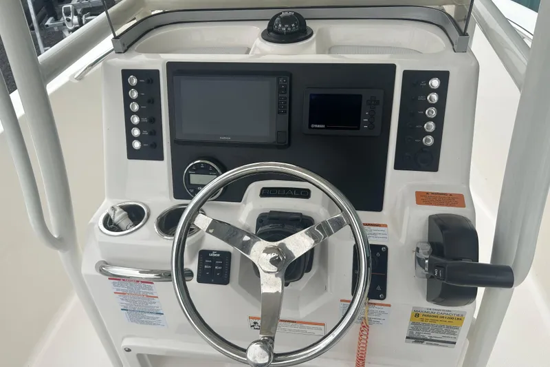 Slide: The Image of 2023 Robalo R180 Center Console boat's outboard motor and propeller detail. - 23
