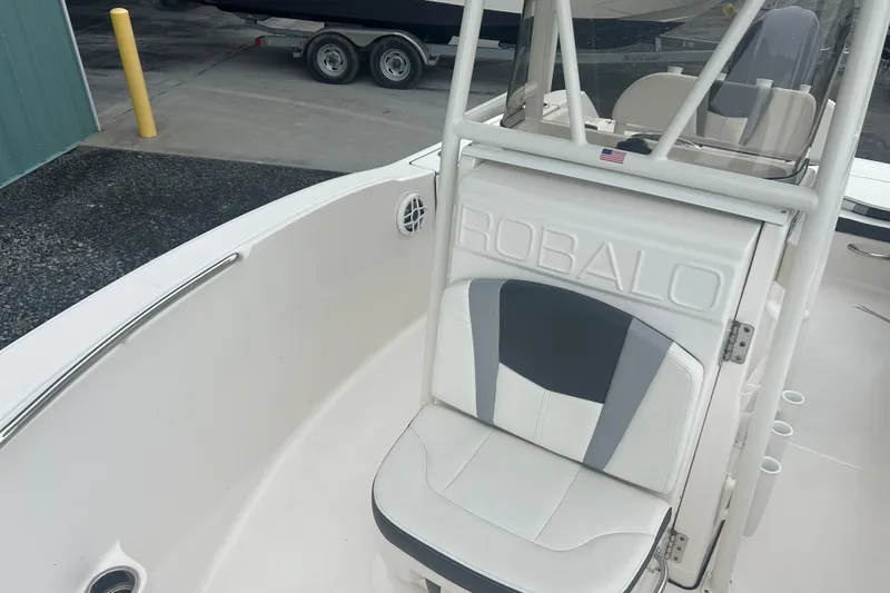 Slide: The Image of 2023 Robalo R180 Center Console boat interior with seating and steering wheel. - 27