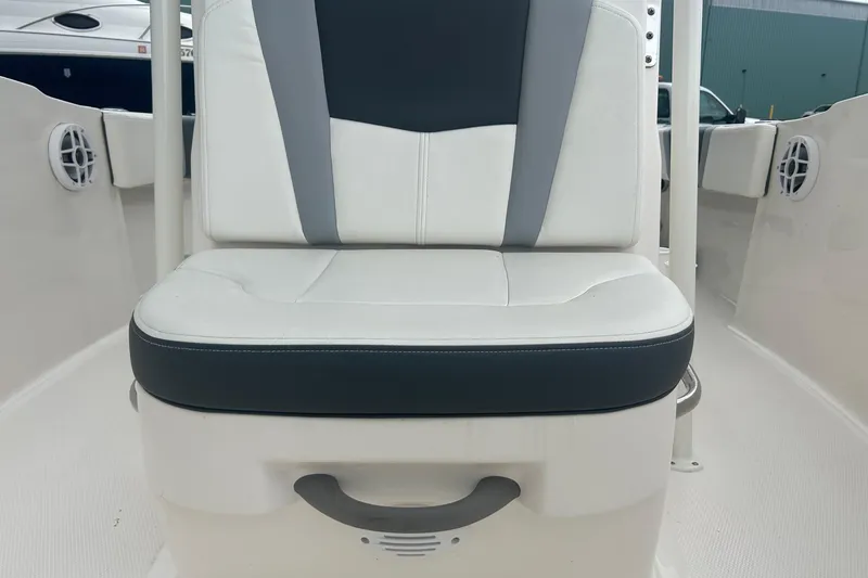 Slide: The Image of 2023 Robalo R180 Center Console boat interior with steering wheel and control panel. - 28