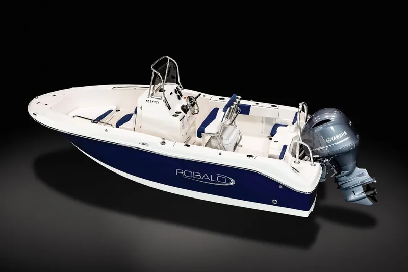 Slide: The Image of 2023 Robalo R180 Center Console boat with Yamaha engine in a garage. - 3