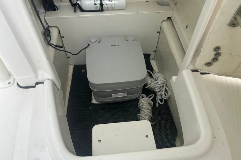 Slide: The Image of 2023 Robalo R180 Center Console boat interior with Yamaha engine, featuring seating and cup holders. - 34