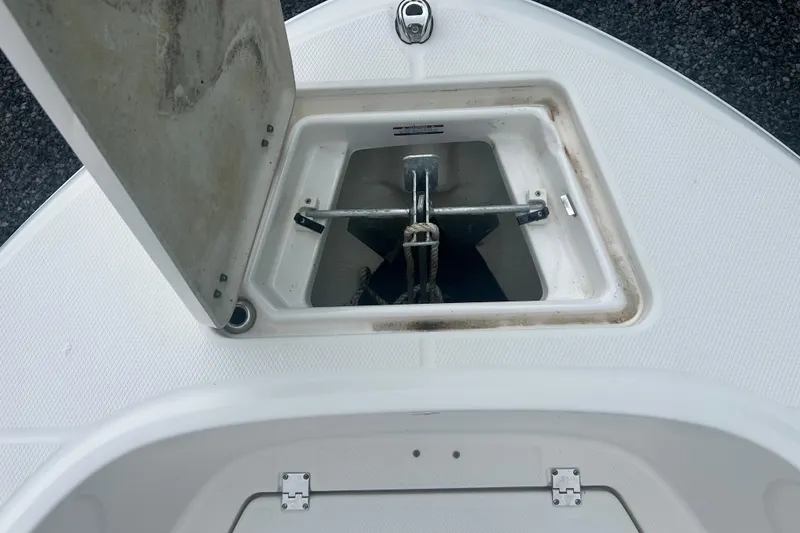 Slide: The Image of 2023 Robalo R180 Center Console boat with Yamaha outboard engine, docked on trailer. - 35