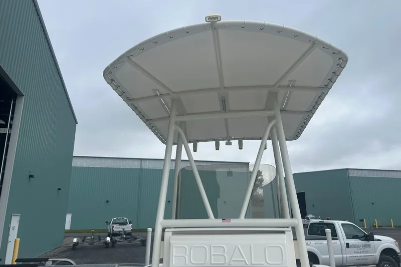 Slide: The Image of 2023 Robalo R180 Center Console boat with Yamaha engine and seating area. - 36