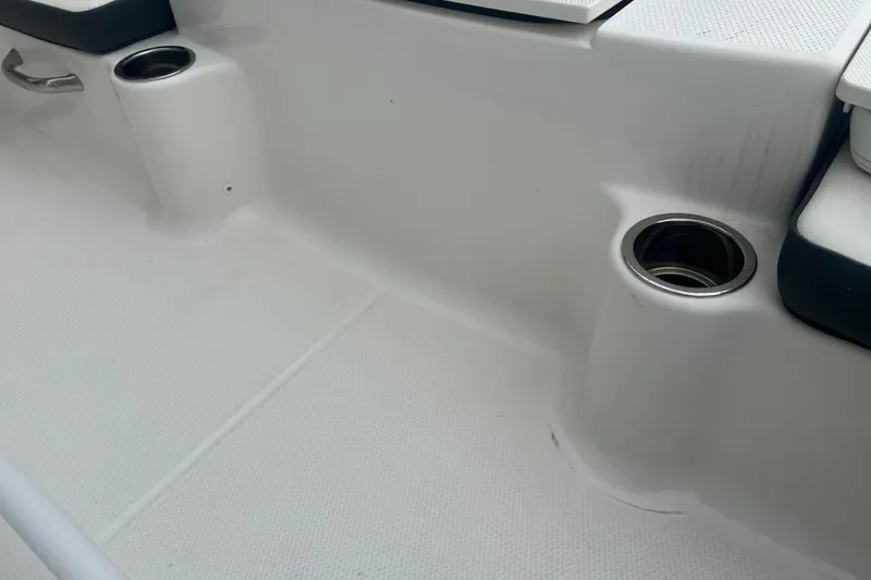 Slide: The Image of 2023 Robalo R180 Center Console boat interior with cushioned seating. - 41