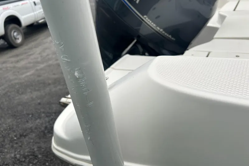 Slide: The Image of 2023 Robalo R180 Center Console boat with rod holders and Coleman cooler. - 46