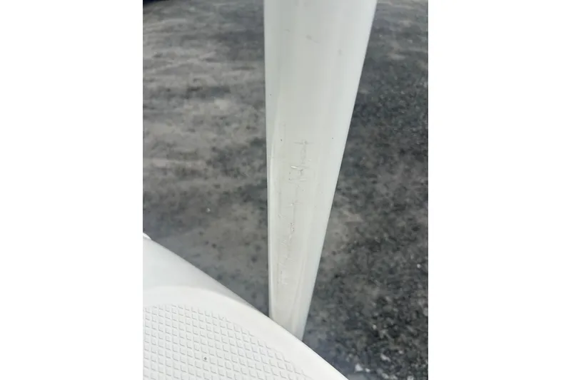 Slide: The Image of 2023 Robalo R180 Center Console boat interior with cushioned seating and sleek design. - 47