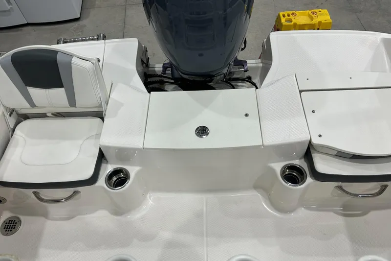 Slide: The Image of 2023 Robalo R180 Center Console boat interior with seating and storage compartments. - 49