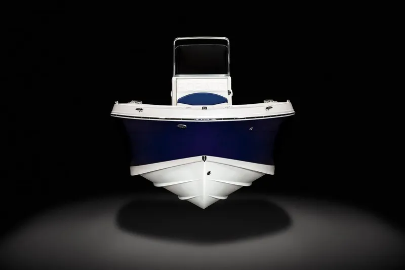 Slide: The Image of 2023 Robalo R180 Center Console boat detail with engine and textured surface. - 5