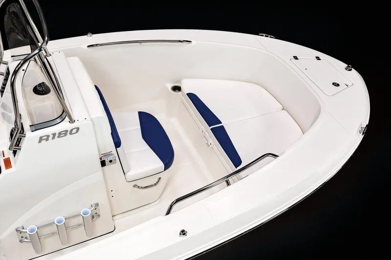 Slide: The Image of 2023 Robalo R180 Center Console boat on trailer in indoor storage. - 7