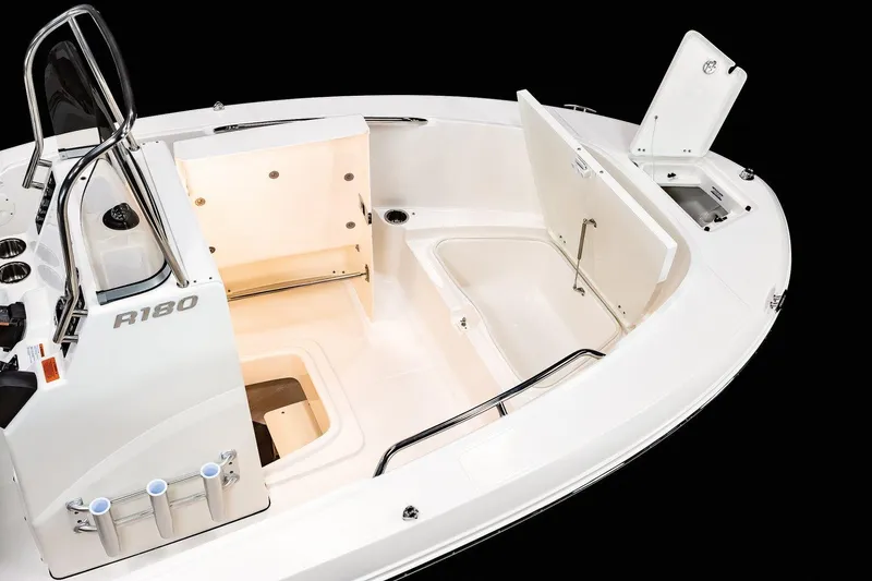 Slide: The Image of 2023 Robalo R180 Center Console boat on trailer, close-up view. - 8