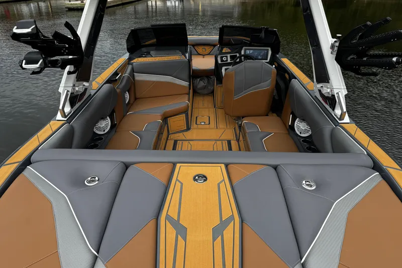 Slide: The Image of 2026 Centurion Nv233 boat interior with luxurious seating and modern design on the water. - 17