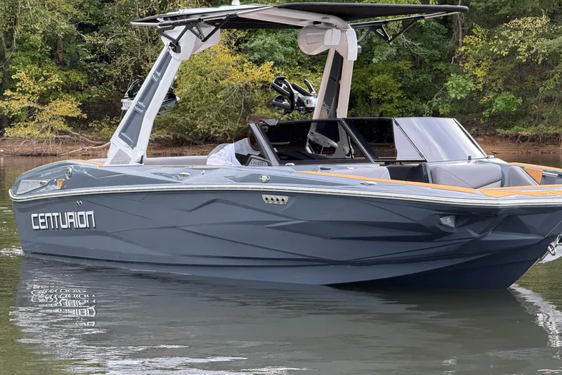Slide: The Image of 2026 Centurion Nv233 boat on calm water, featuring sleek design and modern features. - 6