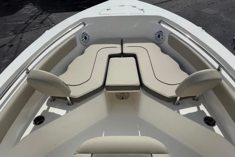 Slide: The Image of 2026 Key West 203 FS boat interior with beige seating and stainless steel railings. - 11