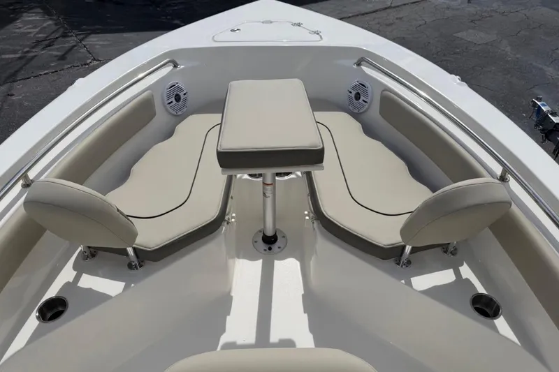 Slide: The Image of 2026 Key West 203 FS boat interior with cushioned seating and table. - 12