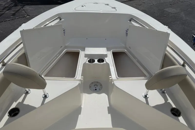 Slide: The Image of 2026 Key West 203 FS boat interior with open storage compartments and seating. - 15