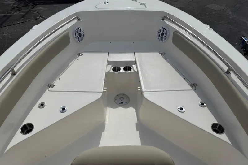 Slide: The Image of 2026 Key West 203 FS boat interior with seating and cup holders. - 16